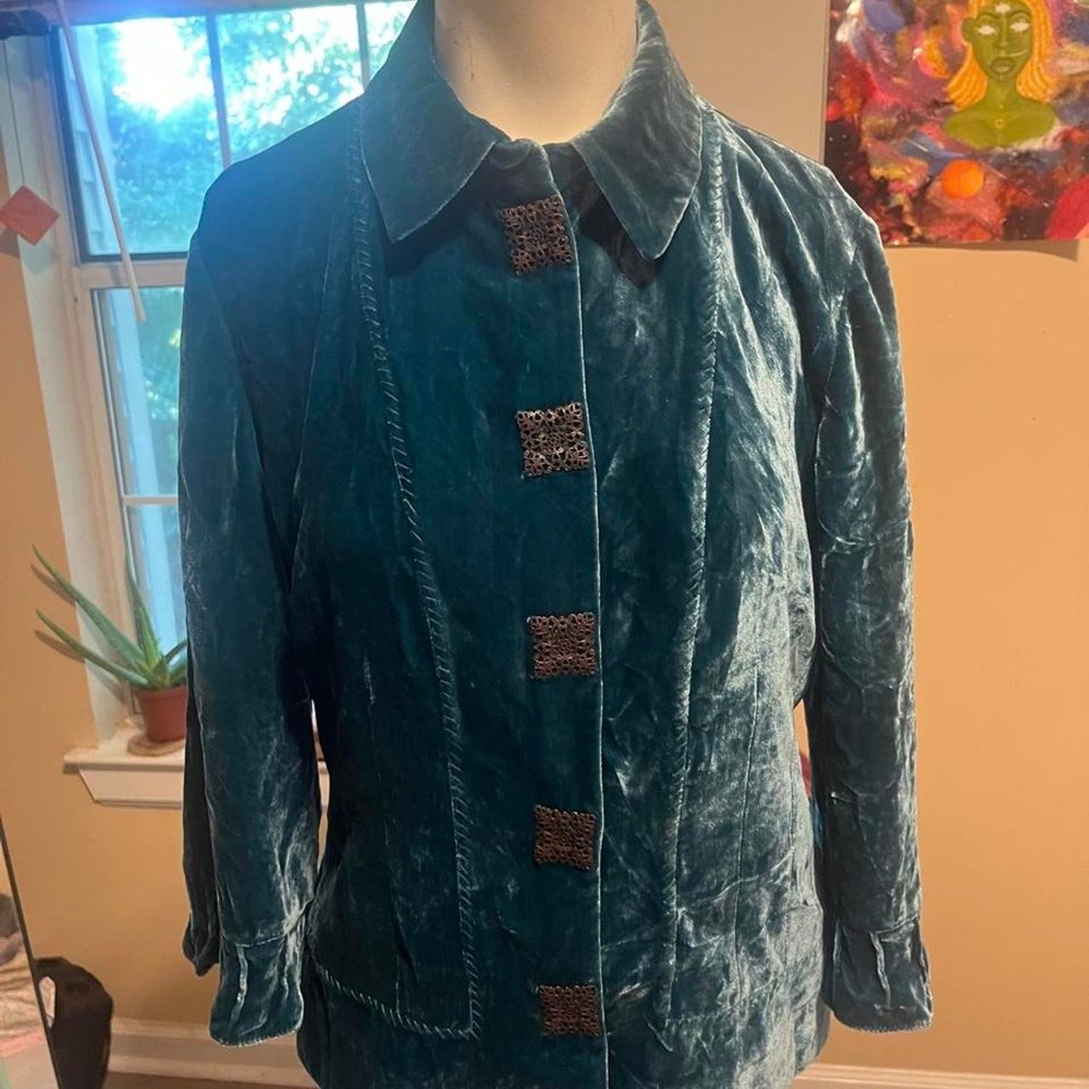 Teal velvet jacket with brown square buttons and ruffled cuffs'